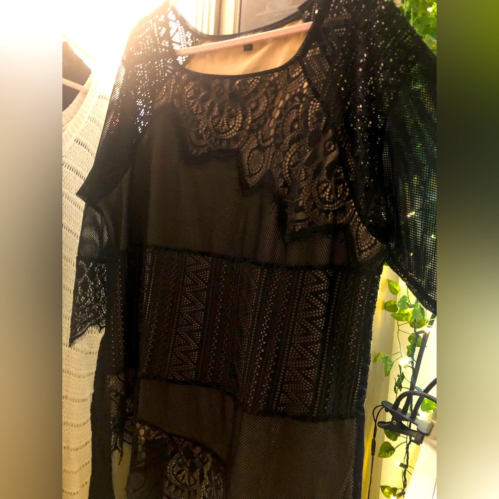 Beautiful formal top. Tan with black lace overlay. Sleeves are mesh and lace.